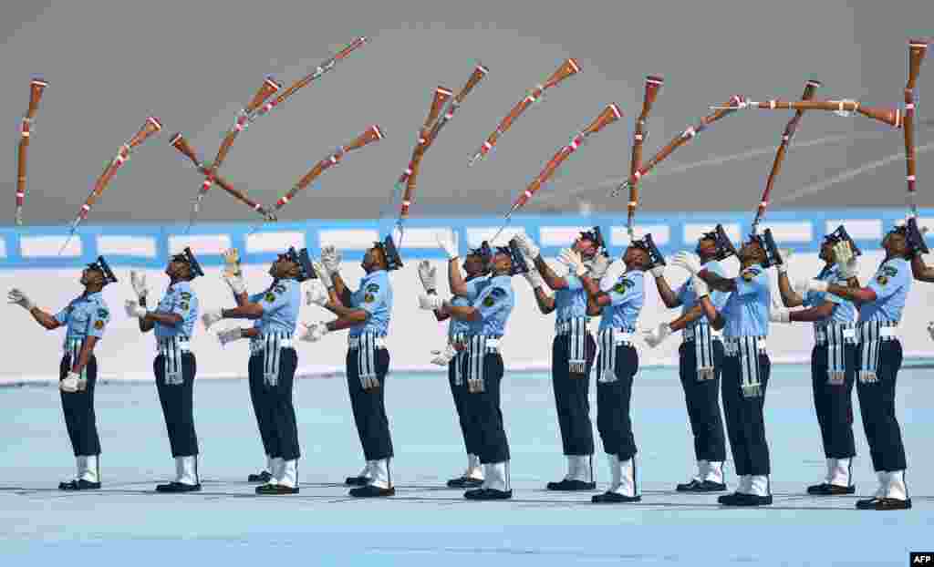 Indian Air Force members perform a drill during a presentation in Guwahati.