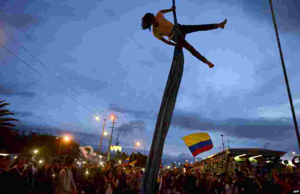 An artist performs during a demonstration against the government of Colombian President Ivan Duque during a national strike in Bogota, Nov. 27, 2019.