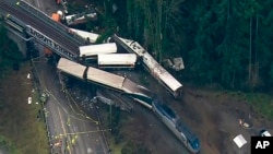 This aerial image from video provided by KOMO-TV, shows the site of an Amtrak train that derailed south of Seattle, Dec. 18, 2017. 