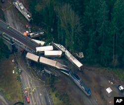 This aerial image from video provided by KOMO-TV, shows the site of an Amtrak train that derailed south of Seattle on Dec. 18, 2017.