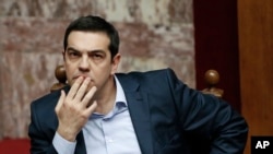 Le Premier ministre grec Alexis Tsipras a évoqué la nécessité d'une nouvelle restructuration de la dette de la Grèce (AP Photo/Petros Giannakouris)
