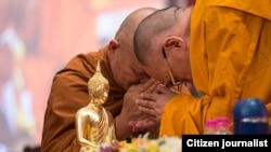 His Holiness the Dalai Lama greeting members of the Thai monastic community on his arrival on the second day of the dialog with Thai Buddhist scholars in New Delhi, India, on December 16, 2012. Photo/Tenzin Choejor/OHHDL