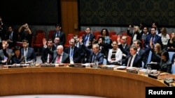Members of the U.N. Security Council vote for cease-fire to Syrian bombing in eastern Ghouta, at U.N. headquarters in New York, Feb. 24, 2018. 