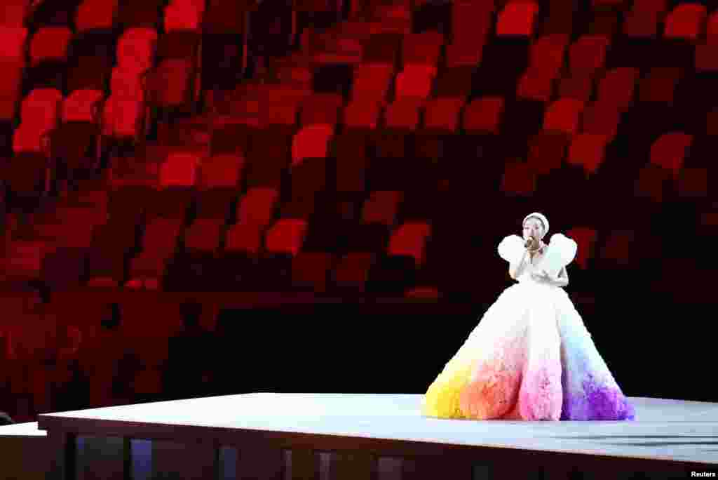 The Tokyo 2020 Olympics Opening Ceremony - Olympic Stadium, Tokyo, Japan - July 23, 2021. A performer sings during the opening ceremony REUTERS/Lucy Nicholson