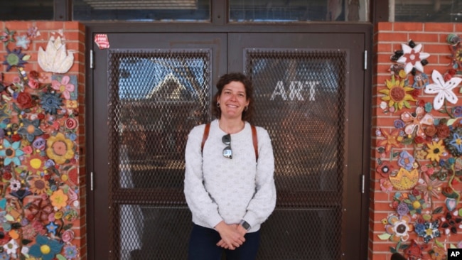 Art teacher Sarah Hager poses outside her classroom at Cleveland Middle School on Sunday, Jan. 23, 2022, in Albuquerque, N.M. (AP)