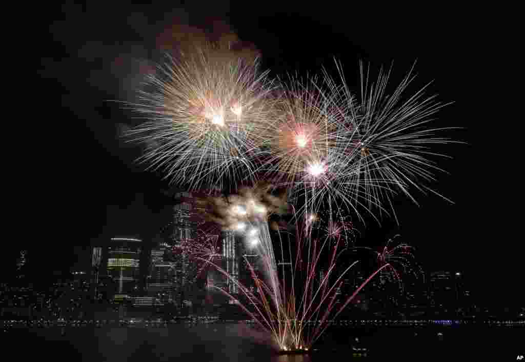 With the New York City skyline as a backdrop, fireworks explode over the Hudson River during the Jersey City Fourth of July fireworks celebration, July 4, 2017.