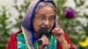 Re-elected Bangladeshi Prime Minister Sheikh Hasina gestures as she speaks with journalists in Dhaka, Bangladesh, Dec. 31, 2018. 