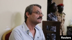 FILE - William John Endley, a South African national and an adviser to South Sudanese rebel leader Riek Machar, sits in the dock, in the High Court in Juba, South Sudan, Feb. 23, 2018. Endley and former Machar spokesman James Gadtet were released from prison Nov. 2, 2018.