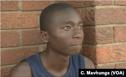 Panashe Chikore, in Harare, Dec. 6, 2018, was hoping to get a temporary job at National Foods during the Christmas season. He is disappointed to hear the company's mills have to close.