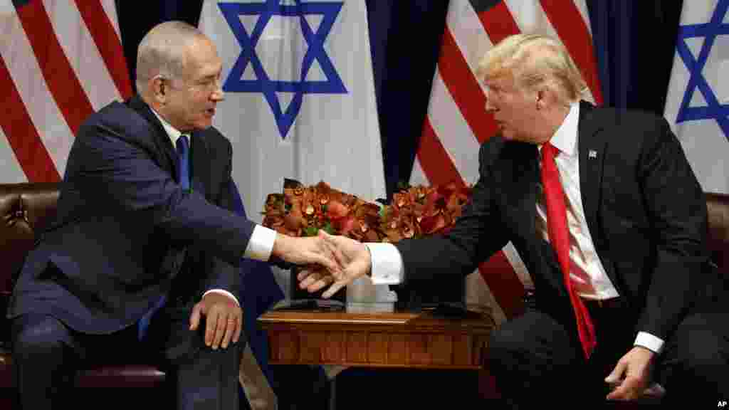 President Trump shakes hands with Israeli Prime Minister Benjamin Netanyahu.