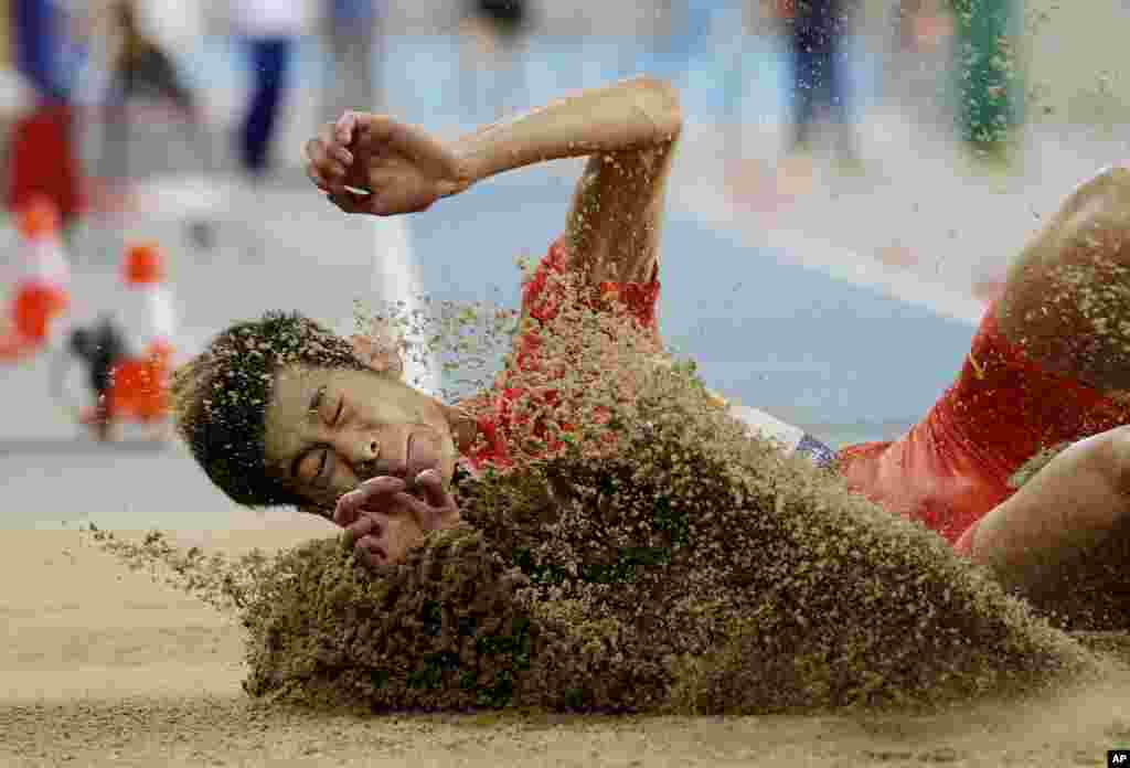China's Gao Xinglong competes in the men's long jump final at the 17th Asian Games in Incheon, South Korea.