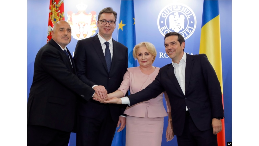 From left, Bulgarian Premier Boyko Borissov, Serbian President Aleksandar Vucic, Romanian Premier Viorica Dancila and Greek Premier Alexis Tsipras pose for media at the end of their meeting at the Victoria Palace, the Romanian government headquarters in Bucharest, Romania, April 24, 2018.