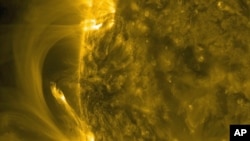 NASA's Solar Dynamics Observatory (SDO) video grab shows ribbons of plasma and magnetic lines bursting from the sun, July, 2014. 