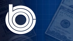 FILE: US Congressional Budget Office logo, over US dollar bills, Oct 7, 2016