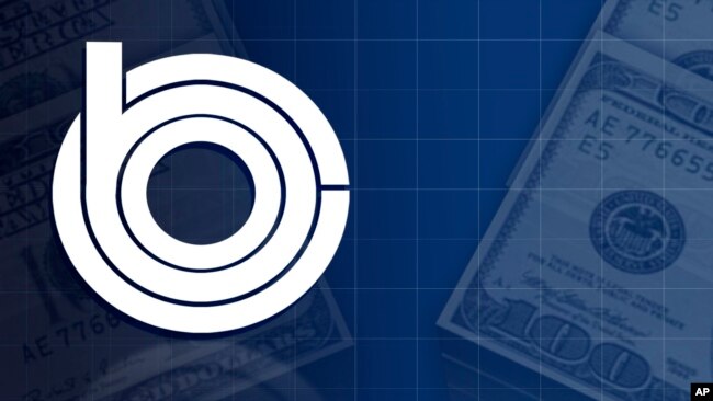 FILE: US Congressional Budget Office logo, over US dollar bills, Oct 7, 2016