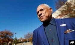 Democrat Mike Espy leaves his precinct after voting in a runoff election, Nov. 27, 2018 in Ridgeland, Mississippi.