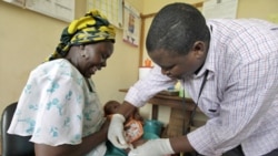 A baby receives an injection of an experimental malaria vaccine in the Kenya coastal town of Kilifi