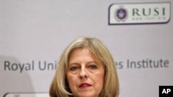 British Home Secretary, Theresa May, addresses guests during a speech at Royal United Services Institute (RUSI) in London, 3 November 2010