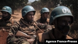 FILE - Moroccan peacekeepers from the U.N. Multidimensional Integrated Stabilization Mission in the Central African Republic (MINUSCA) patrol in Bangassou, Feb. 3, 2021. The force's mandate has been extended until November 2025.