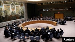 FILE - Members of the Security Council gather for a meeting on building regional partnership in Afghanistan and Central Asia at the United Nations in New York, Jan. 19, 2018.