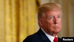 FILE - U.S. President Donald Trump listens during a news conference at the White House in Washington, Aug. 28, 2017.