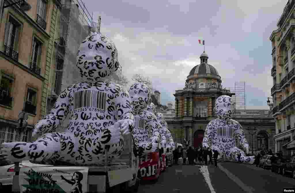 Giant inflatable babies, installed by members of the &quot;Manif Pour Tous&quot; (Demonstration For All) are seen during a protest against medically assisted procreation PMA, surrogate motherhood GPA and the bioethics bill in front of the French Senate in Paris.