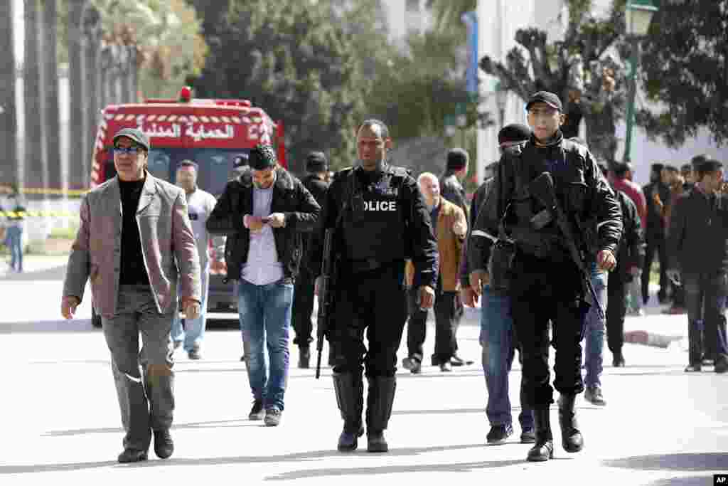 Police officers leave the Bardo museum a day after gunmen opened fire killing over 20 people, mainly tourists, in Tunis, Tunisia, March 19, 2015.