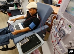 FILE - A patient undergoes dialysis at a clinic in Sacramento, Calif., Sept. 24, 2018. Of the eight initiatives on California's Tuesday ballot, the costliest thus far is Proposition 8, a measure that would cap profits for dialysis clinics.