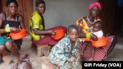 HIV sufferers in South Sudan take a meal at the Zereda center in Western Equatoria state, where the infection rate is more than twice the national average.