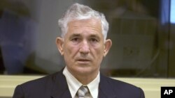 FILE - Gen. Mile Mrksic is seen during a pre-trial hearing at the War Crimes tribunal in The Hangue, Netherlands, Oct. 10, 2005. 
