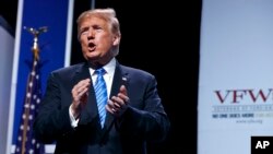 President Donald Trump walks off after speaking to the Veterans of Foreign Wars of the United States National Convention, in Kansas City, Missouri. 