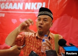 Former Indonesian militant Sofyan Tsauri talks to reporters during a meeting between former militants and victims in Jakarta, Indonesia, Feb. 28, 2018.