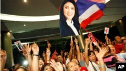 Political novice Yingluck Shinawatra says she has formed a coalition with four smaller parties, boosting her majority in parliament a day after being elected Thailand's first female prime minister.