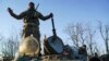 Ukrainian soldiers stand atop an armored personnel carrier near Urzuf on the south coast of Azov sea, eastern Ukraine, Nov. 29, 2018.