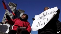 Haitian activists and immigrants protest on City Hall Plaza in Boston, Massachusetts, Jan. 26, 2018.