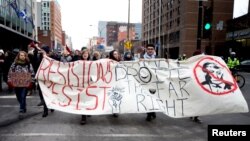 Protesters against US President Donald Trump march in downtown Montreal, Canada, Jan. 20, 2017.