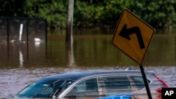 A car flooded on a local street as a result of the remnants of Hurricane Ida is seen in Somerville, N.J. Sept. 2, 2021.