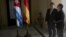 Germany's Economy Minister Sigmar Gabriel, left, and Cuba's Foreign Minister Bruno Rodriguez look at the ceiling of the building housing the foreign ministry prior to a meeting in Havana, Jan. 7, 2016.