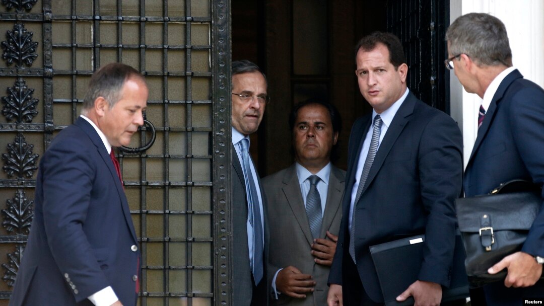 European Central Bank Executive Board member Benoit Coeure (L), Greece's Prime Minister Antonis Samaras (2nd L) and European Central Bank Mission Chief for Greece Klaus Masuch (R) talk after a meeting at the Prime minister's office in Athens, August 28, 2014.