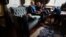 FILE - Baraka Lusambo, 7, Pendo Noni 16, Emmanuel Rutema, 15, and Mwigulu Magesaa 14, Tanzanians with albinism who had body parts chopped off in witchcraft-driven attacks, relax at a home in the Staten Island borough of New York City, June 4, 2017.