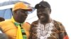 FILE: Former Prime Minister Morgan Tsvangirai shares a joke with his former finance minister, Tendai Biti, at a rally of about 500 people in Harare, March 22, 2017. 