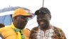 Former Prime Minister Morgan Tsvangirai shares a joke with his former finance minister, Tendai Biti, at a rally of about 500 people in Harare, March 22, 2017. Tsvangirai said the next election is heading for a dispute unless the Zimbabwe Electoral Commiss