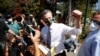 California Gov. Gavin Newsom takes photos with supporters after speaking at St. Mary's Center during a Stop the Recall rally ahead of the Republican-led recall election, in Oakland, Calif., Sept. 11, 2021.