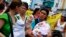 Women march with their children to demand longer maternity leave, San Jose, Costa Rica, Jan. 18, 2013.
