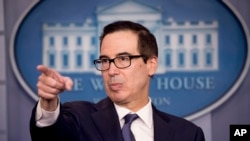 FILE - Treasury Secretary Steven Mnuchin takes a question from a reporter in the Briefing Room of the White House in Washington, Oct. 11, 2019.