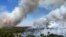 FILE - Smoke rises as fires spread through the Brasilia National Forest, Brazil, in the middle of the dry season, Sept. 3, 2024.