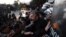Protesting farmers scuffle with riot police officers during a rally in the northern Greek city of Thessaloniki, Jan. 28, 2016.
