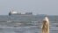 Vessels in the Strait of Hormuz near the beach of Bandar Abbas