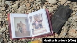An family photo album lies among debris and blood where civilians were shot down by Islamic State snipers in early June, in Mosul, Iraq, June 15, 2017.
