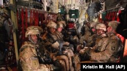 U.S. Army soldiers from the 3rd Brigade Combat Team, 101st Airborne Division sit on a plane at Forward Operating Base Salerno in Afghanistan to return home to Fort Campbell, Ky., May 21, 2013 